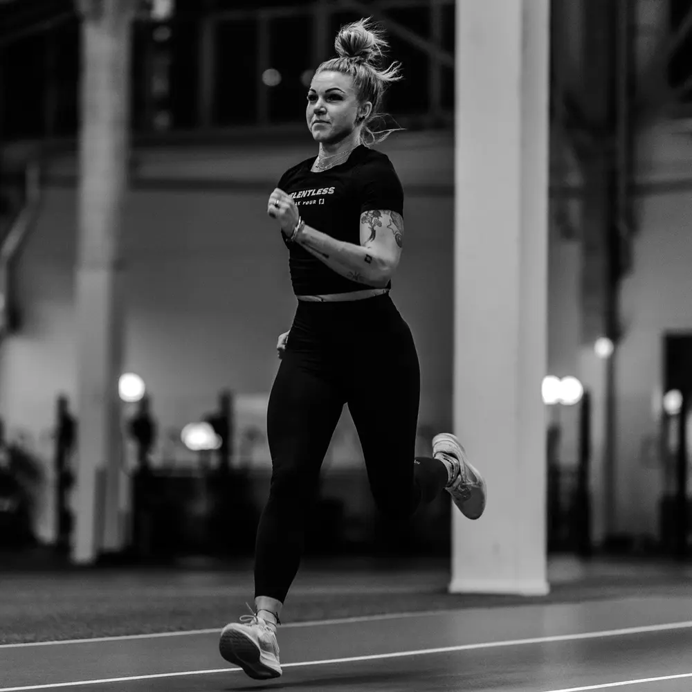 A runner on an indoor track.